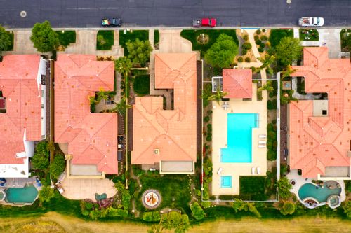 Free Aerial view showing suburban homes with pools in La Quinta, California, highlighting luxury lifestyle. Stock Photo
