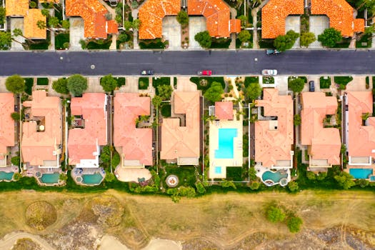 Stunning aerial view of resort-style homes with swimming pools in La Quinta, California.