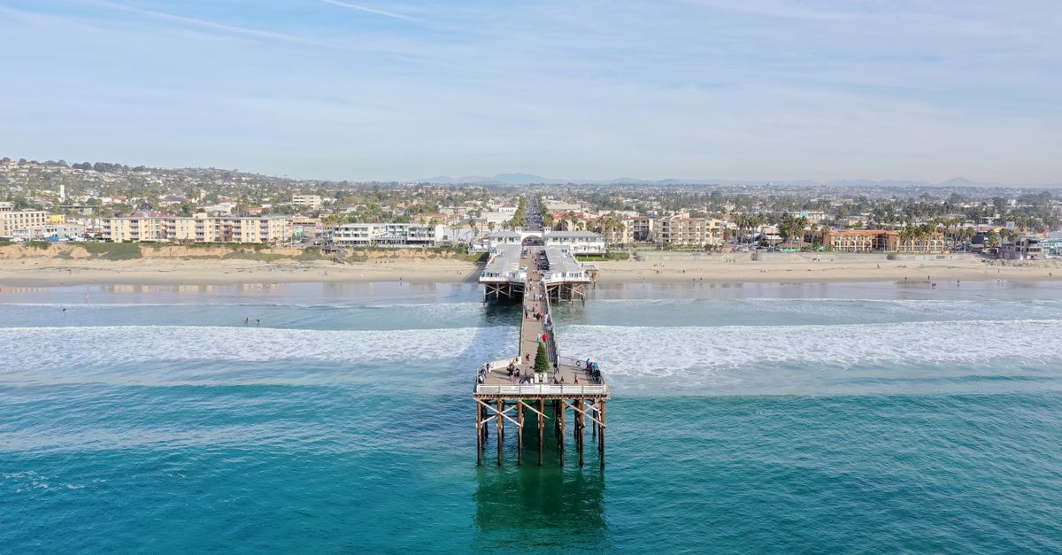 Stunning aerial view of Pacific Beach Pier overlooking the ocean and coastline in San Diego, California.