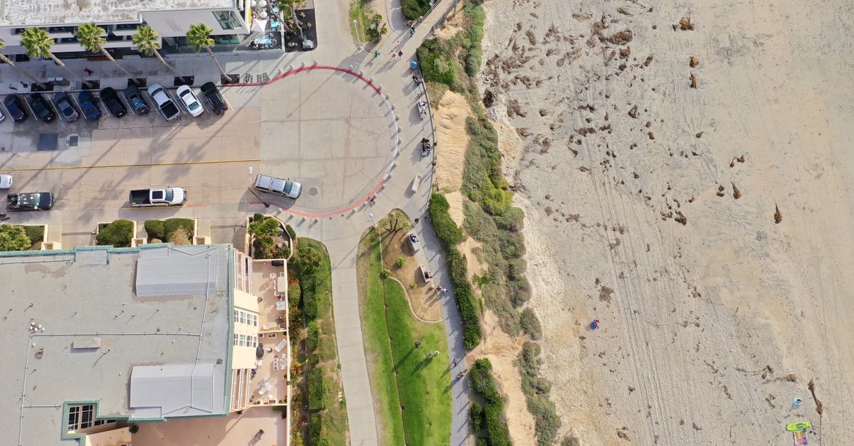 Aerial photograph of San Diego's beachfront, capturing urban architecture and sandy shore. Perfect for travel and architecture themes.