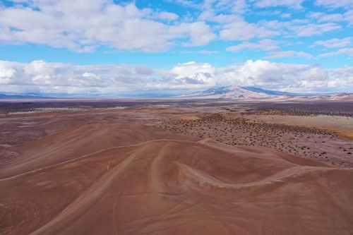 Free Stunning aerial view of a barren desert landscape under a bright blue sky near Beatty, Nevada. Stock Photo