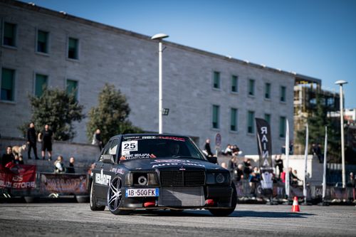Free Black drift car in action on a race track, showcasing speed and performance. Stock Photo