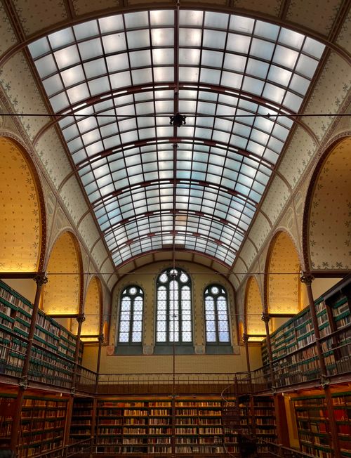 Free Gorgeous library interior featuring a stunning glass ceiling and classic architecture. Stock Photo