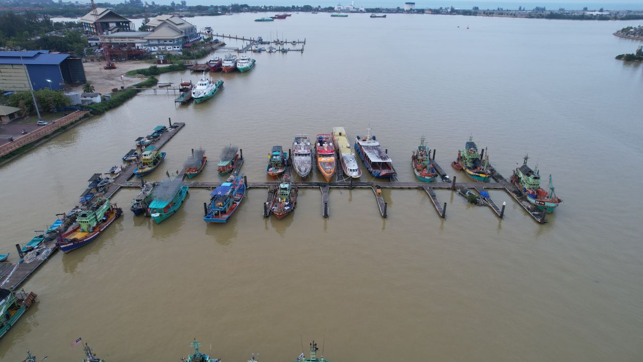 An Aerial Shot of a River with Docked Boats · Free Stock Photo