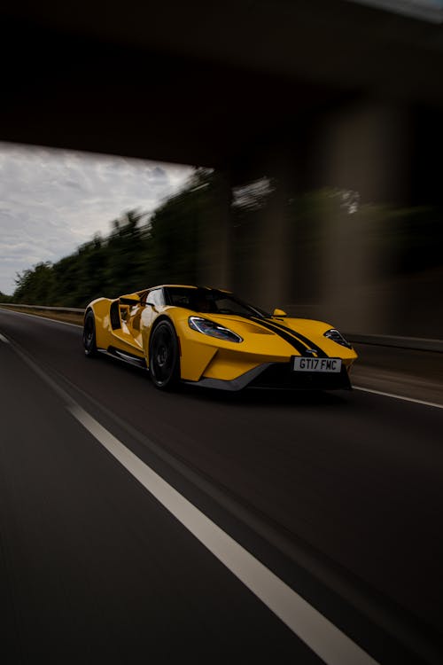 A Yellow Ford GT Sports Car on Highway Road