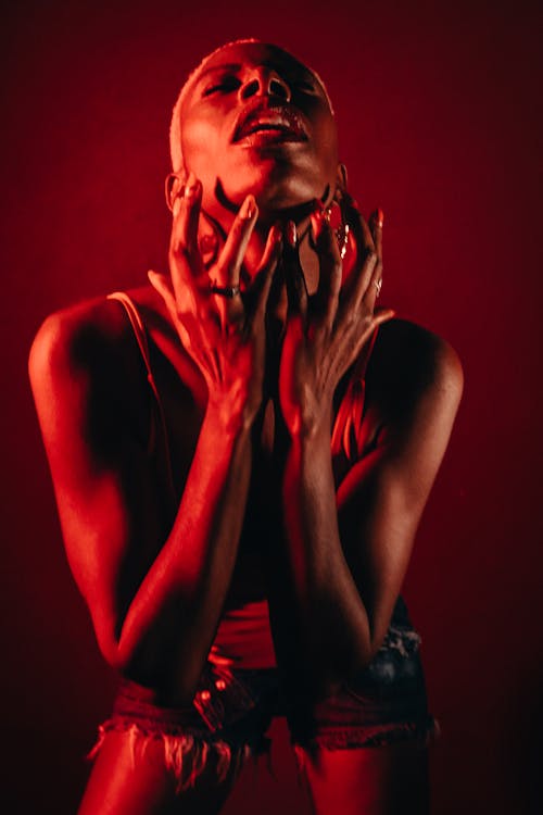 Woman Posing in Red Background
