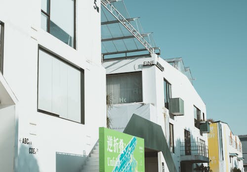 White Concrete Building with Glass Ceiling 