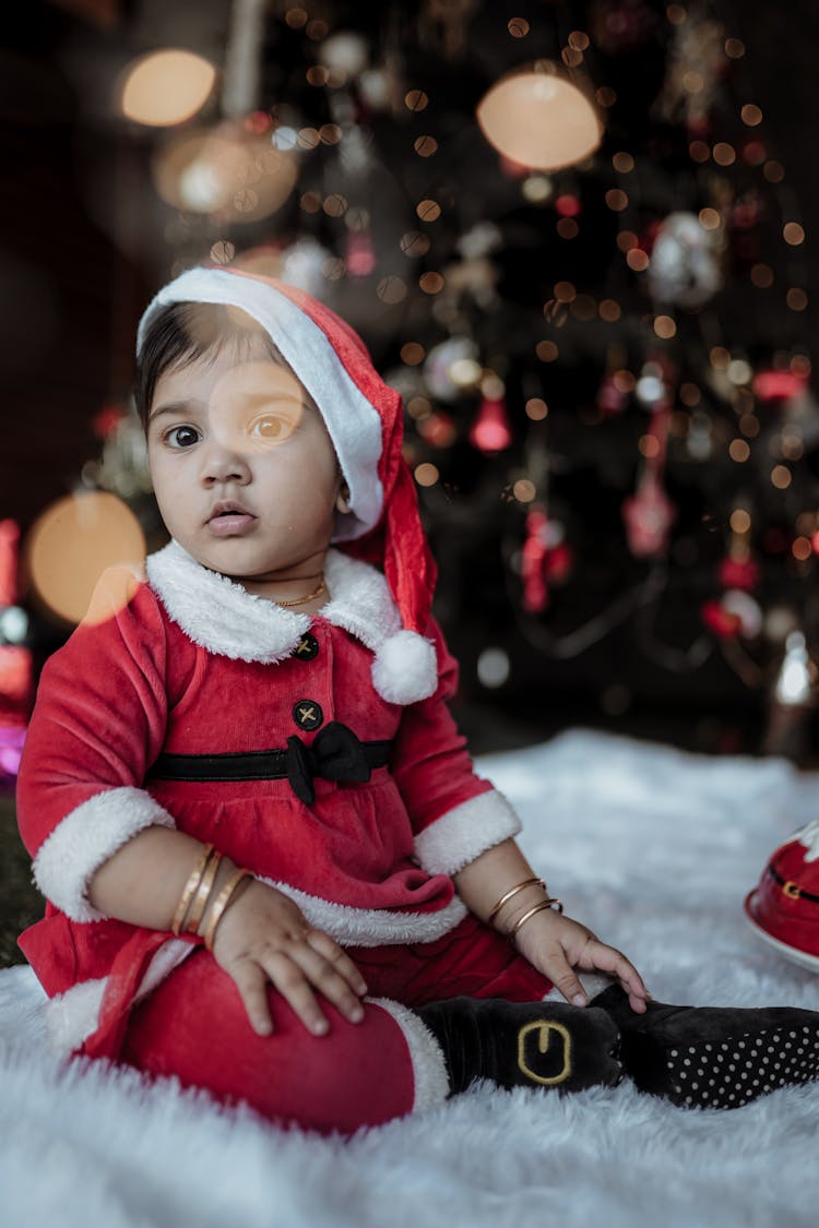 Photo Of A Toddler Wearing Santa Hat