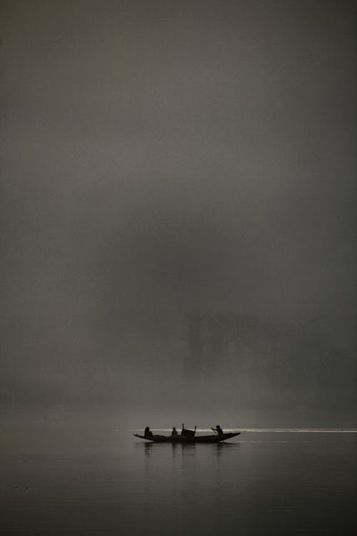 Boat Sailing in the Fog