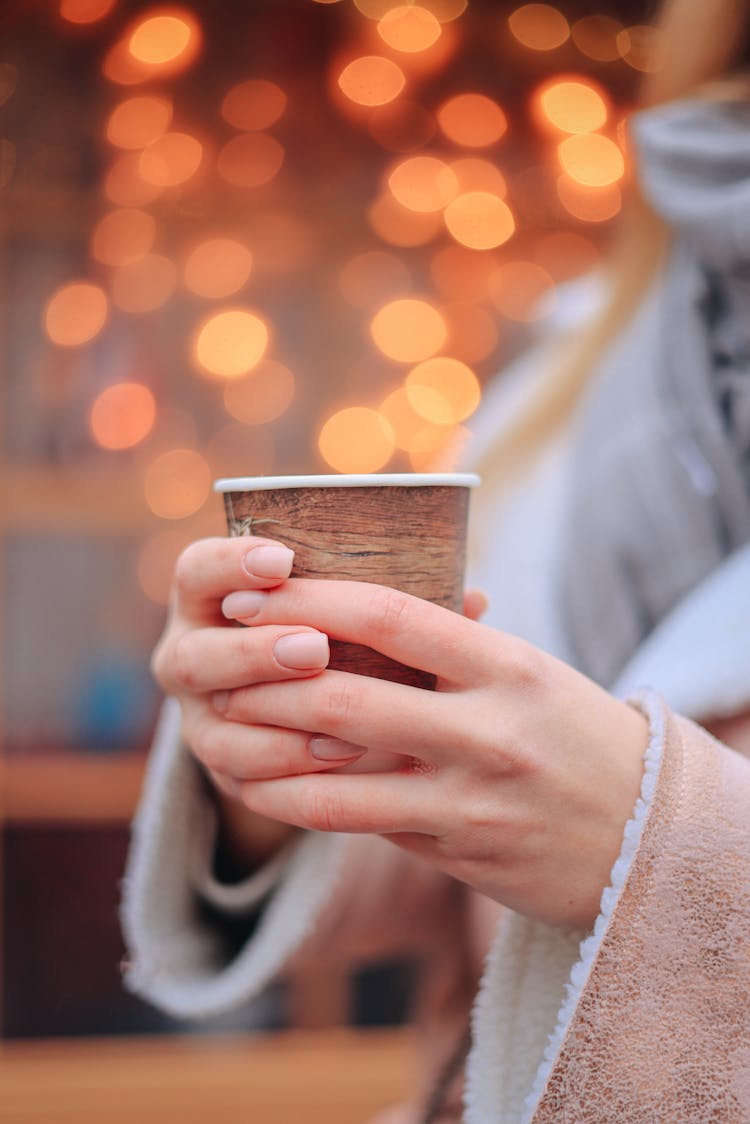 Woman Holding Cup In Winter