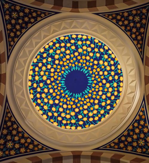 Free Intricate mosaic ceiling with geometric patterns in Ottoman mosque style illumination. Stock Photo