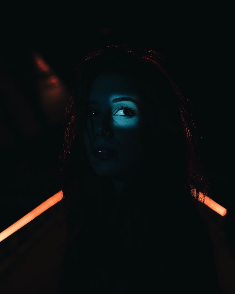 Light On Woman Eye In Darkness