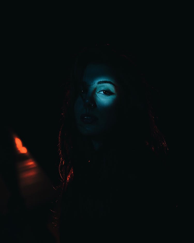 Light On Woman Eye In Darkness