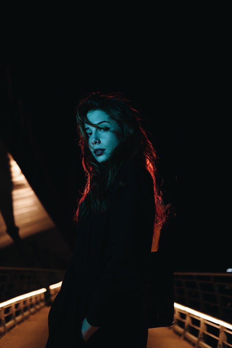 Woman Posing On Night Bridge