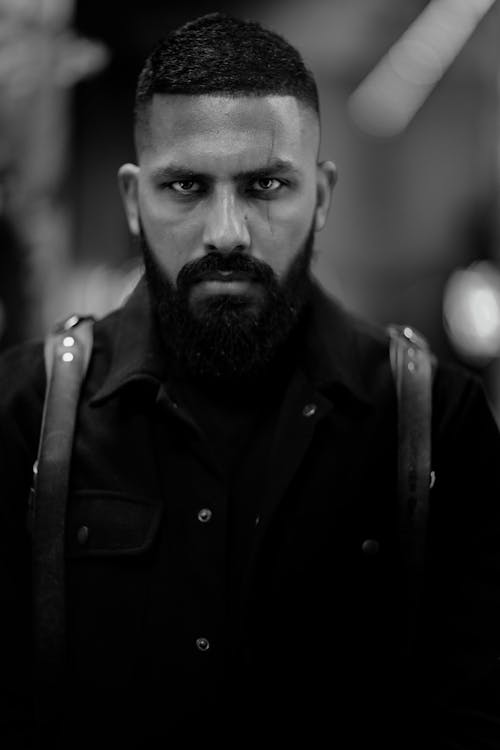 Grayscale Photo of Man in Black Jacket