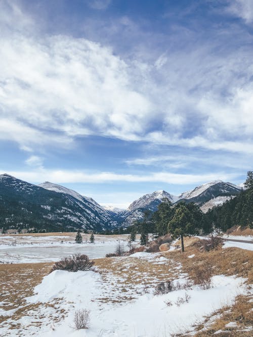 Free Snow Covered Mountains Under Blue Sky Stock Photo