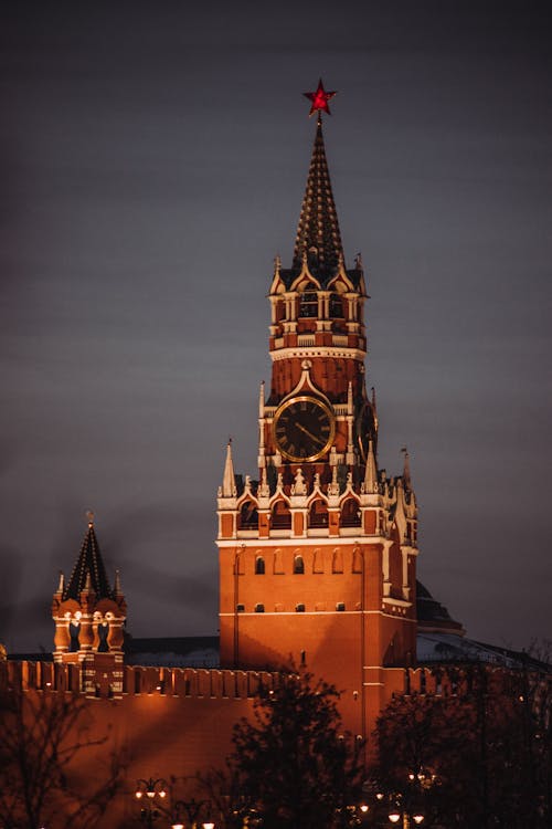 A Brown Clock Tower During Night Time