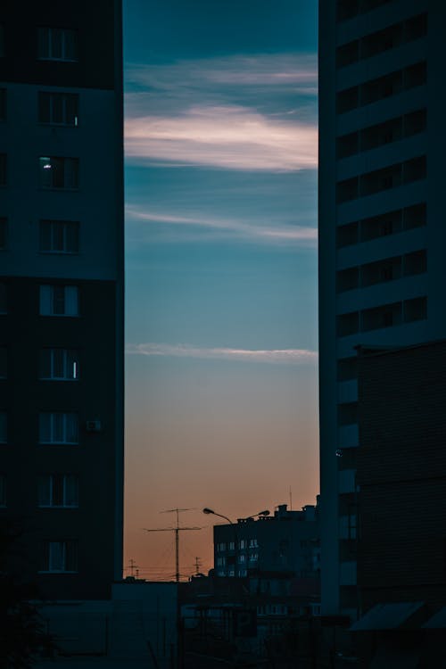 Silhouette of Apartment Buildings duirng Dusk 