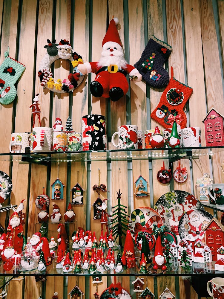 Santa Figurines On A Shelf