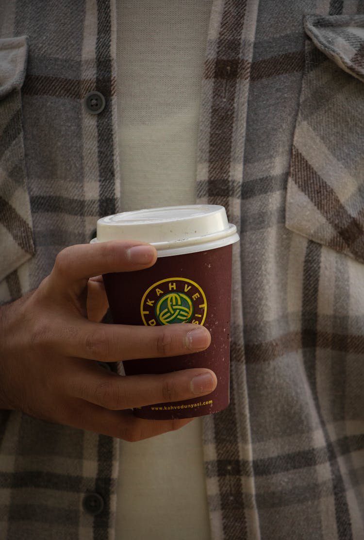 Man Holding Cup Of Coffee