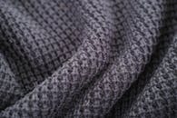 灰色羊毛针织面料的纹理和图案特写