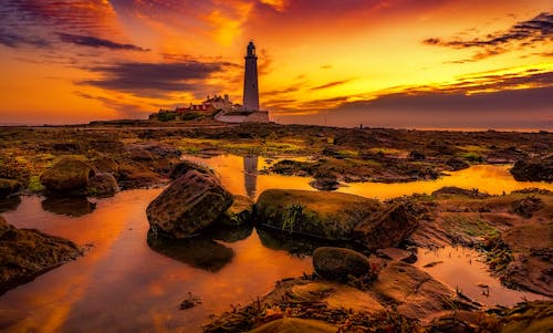 Free White Lighthouse during Golden Hour Stock Photo