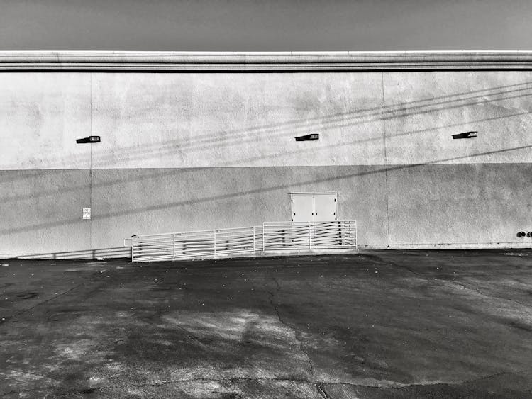 Grayscale Photo Of A Building Wall