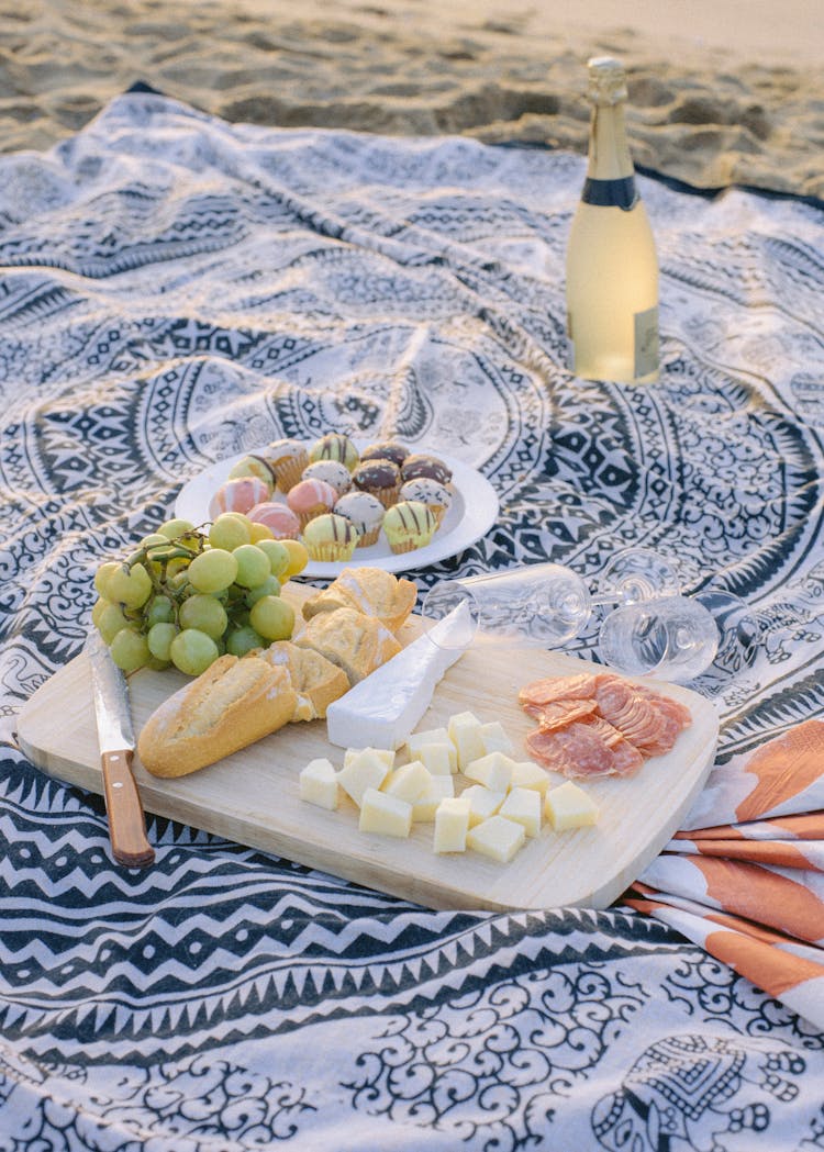 Cheese, Baguette And Grapes At Picnic