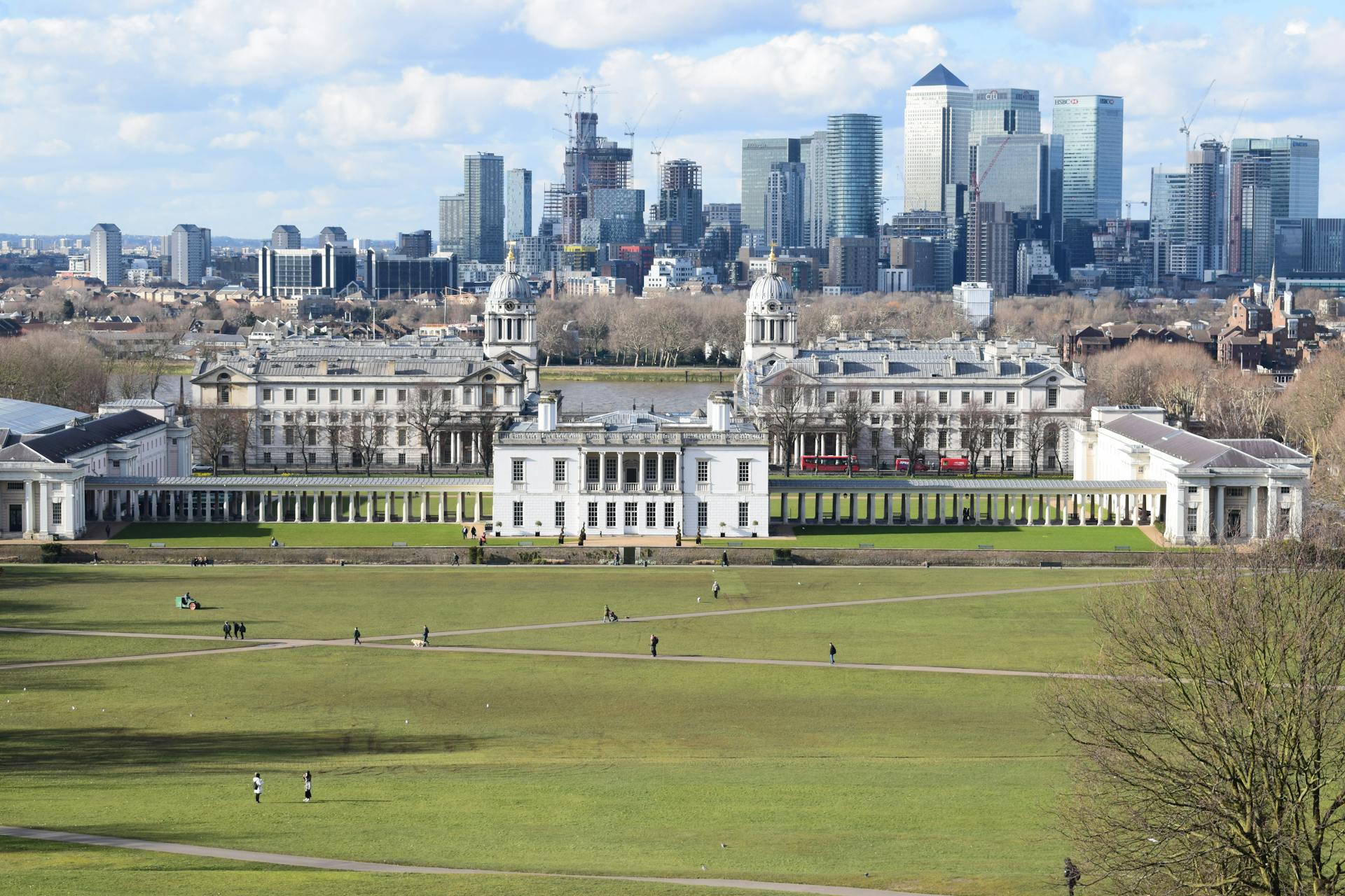 Stunning aerial view of Greenwich Park with London skyline in the background.