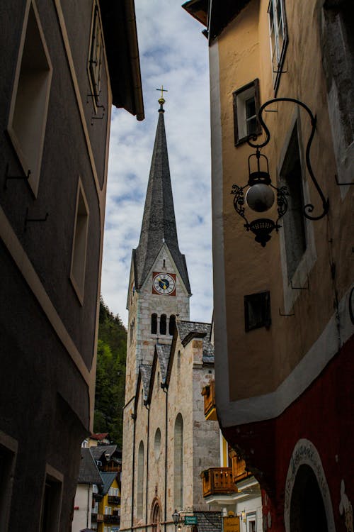 Church Tower behind Buildings Walls
