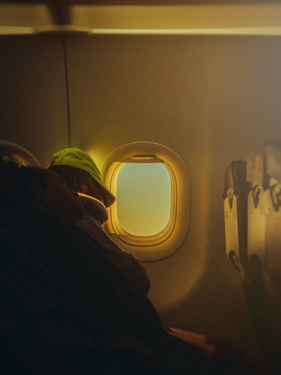 Free People Sleeping Inside an Airplane Stock Photo