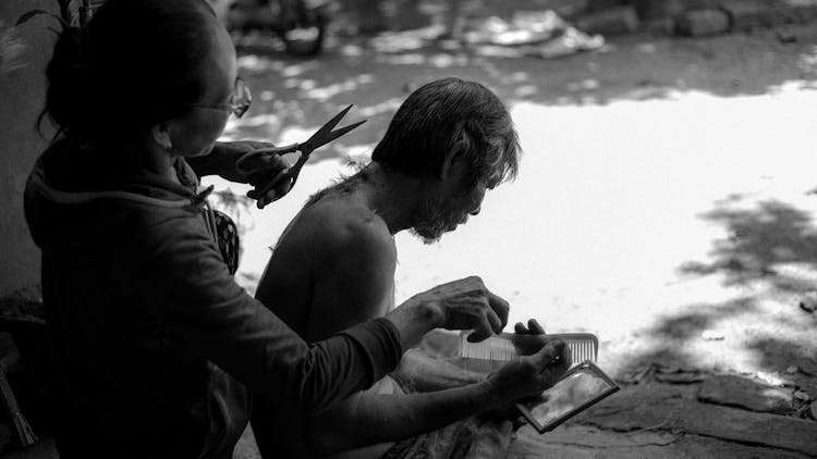 Woman Cutting Man Hair