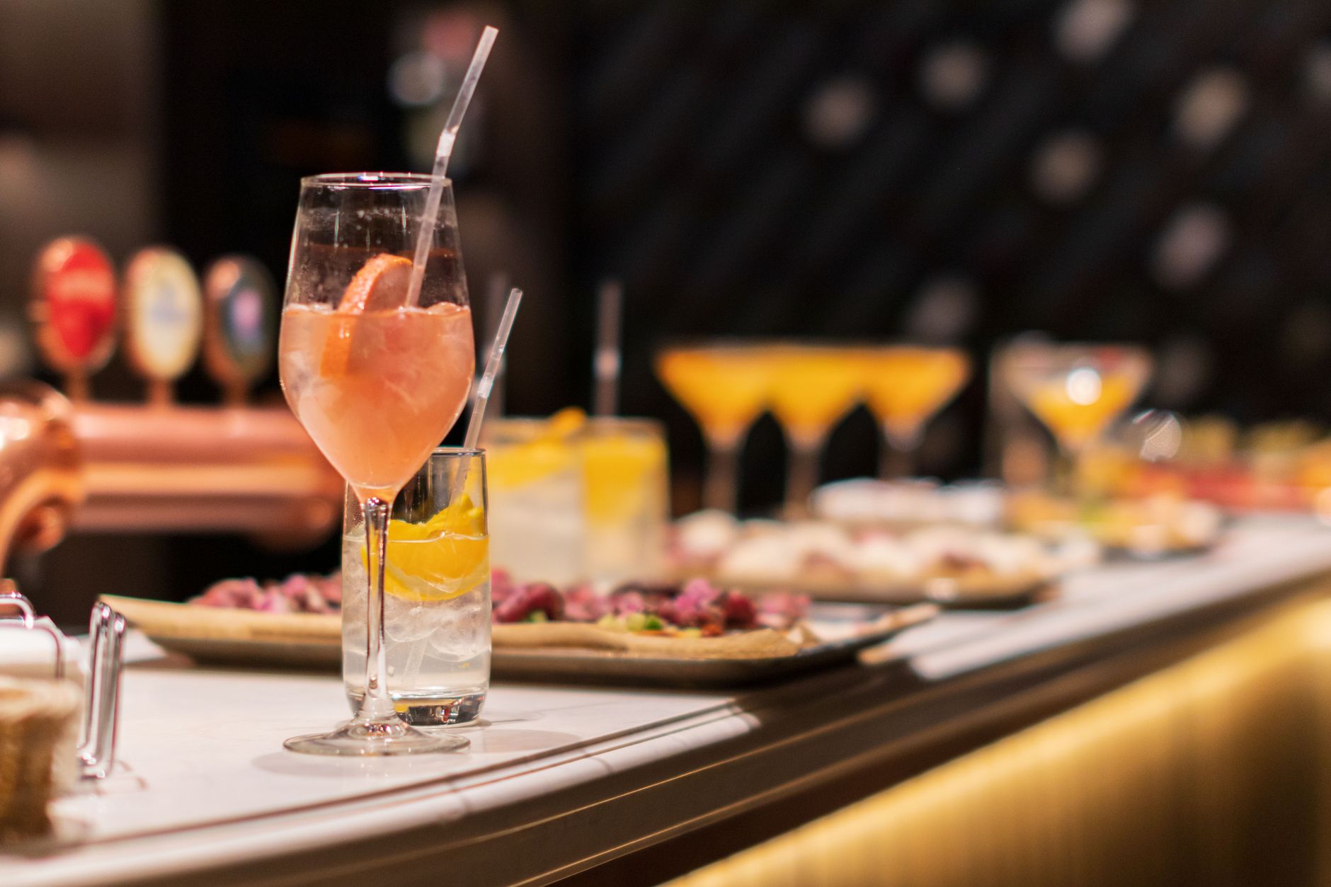 Late-night cocktails and appetizers at a stylish bar