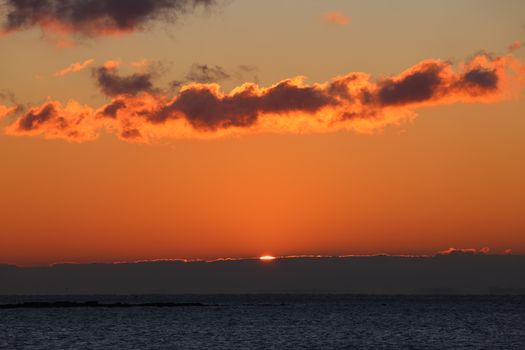 Captivating sunrise with vibrant orange hues over the Stamford, CT ocean.