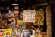 A charming vintage market stall featuring retro items and a "Love" sign.
