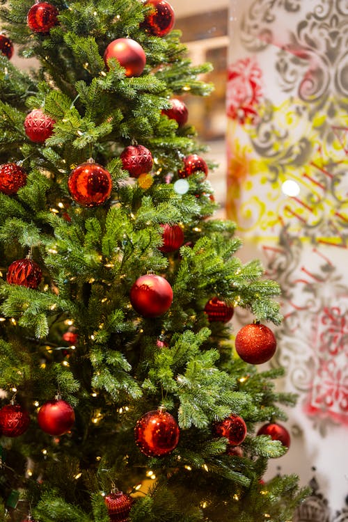 Red Christmas Balls Hanging on a Christmas Tree