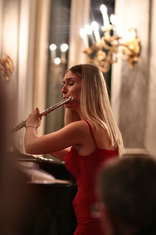 Blonde Woman Playing Flute