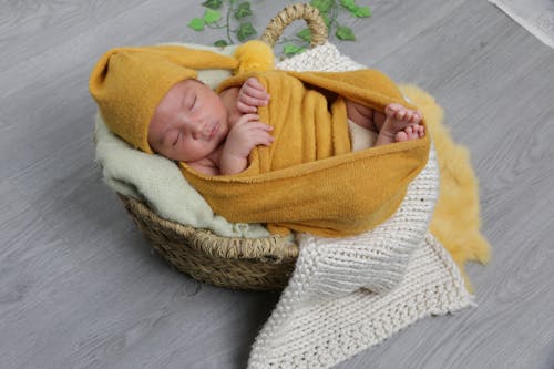 Baby Wrapped in Yellow Blanket Sleeping