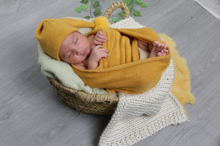 Baby Wrapped In Yellow Blanket Sleeping