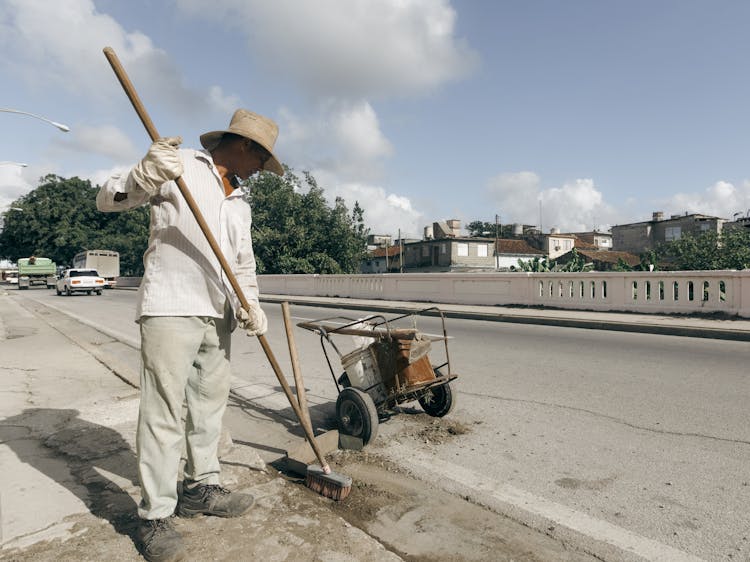 Man Cleaning Street