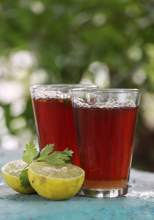 Glasses of Tea on Concrete Surface