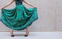 Woman Wearing Green And Black Sleeveless Dress