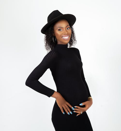 A Pregnant Woman Wearing Black Long Sleeves