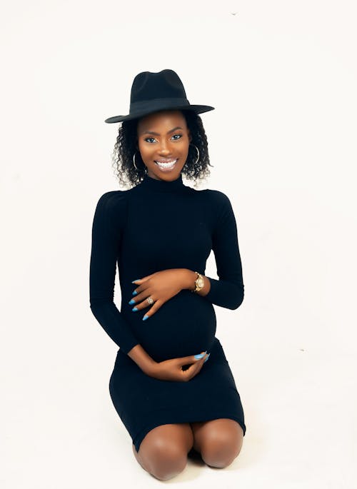 Woman in Black Clothes Posing on White Background