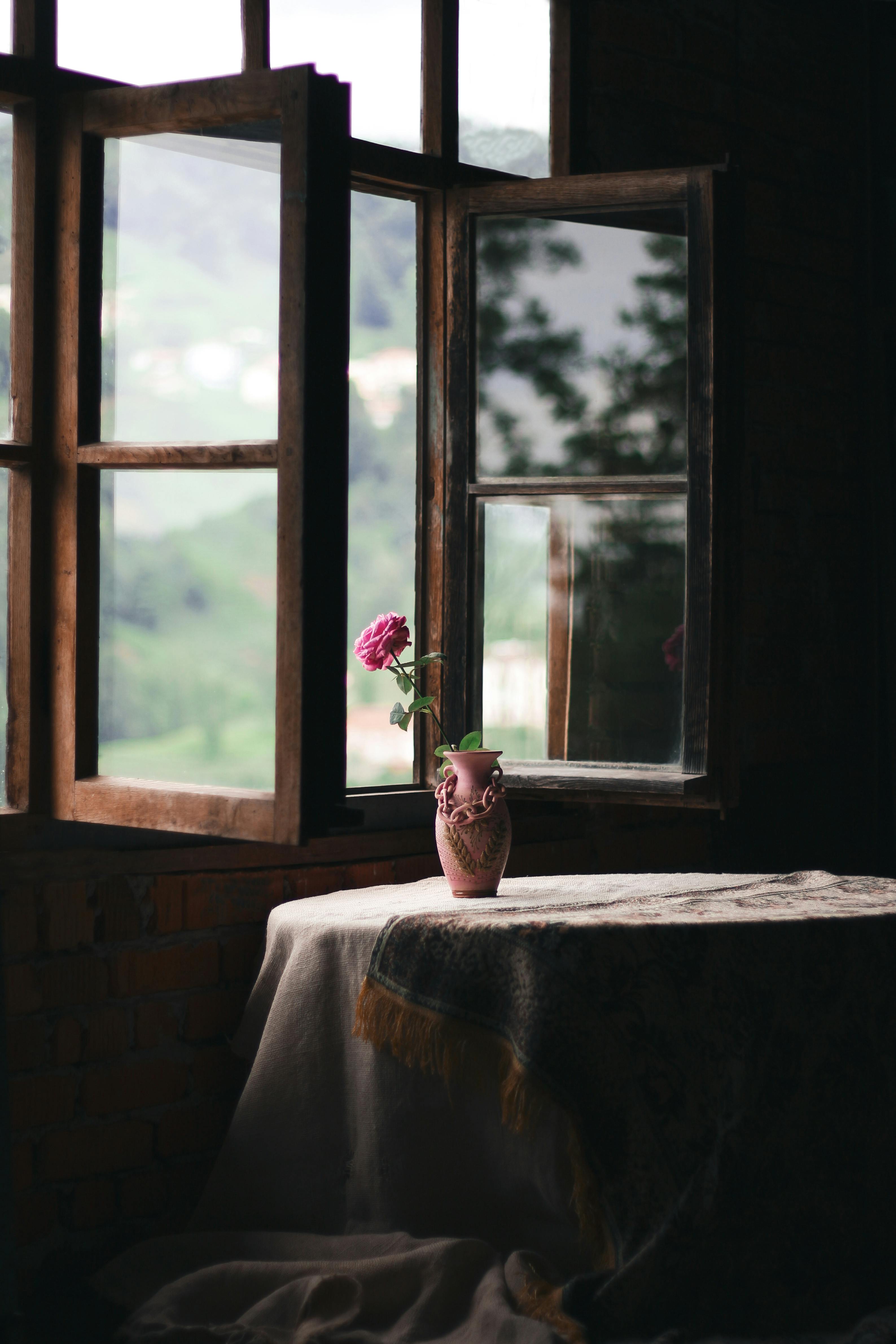 flower in vase on table in rustic house