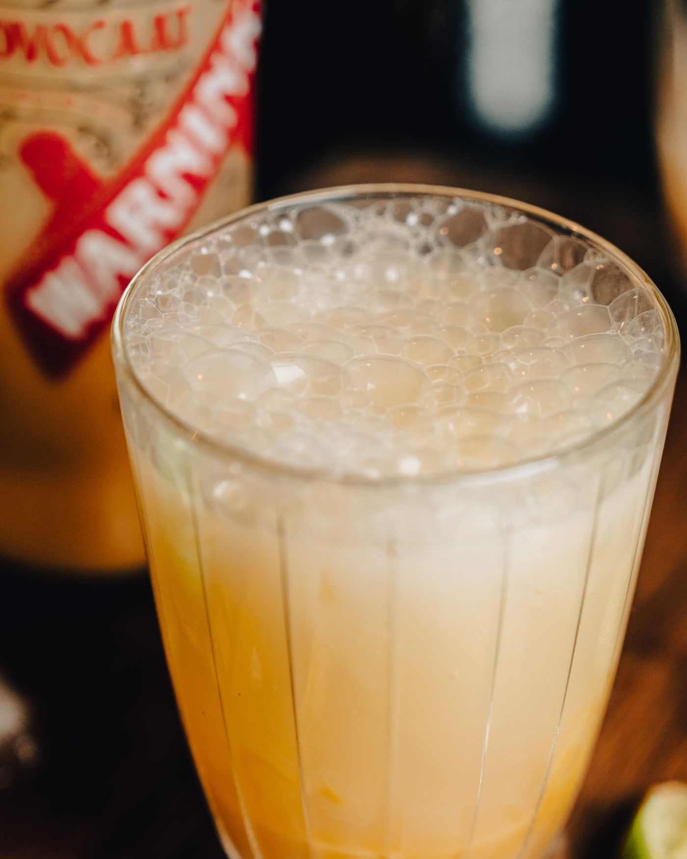 Sparkling citrus beverage with visible bubbles in a clear glass