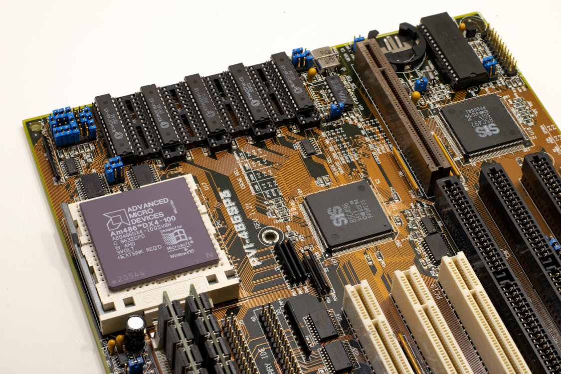 Microchip Processor on a White Surface · Free Stock Photo