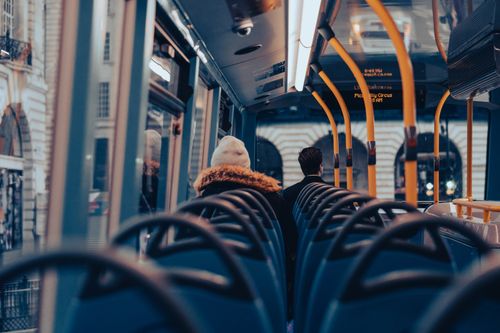 Free Passengers traveling on a city bus through London, capturing urban commuting life. Stock Photo