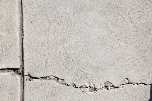 Free Cracked Concrete Wall in Close-up Photography Stock Photo