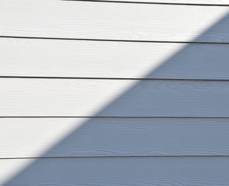 Various types of siding materials displayed on a home exterior